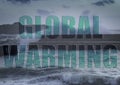 Global Warming - sea waves crashing over wall defences Royalty Free Stock Photo