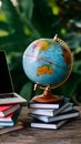 Globalization business or education concept with globe and laptop on books pile Royalty Free Stock Photo