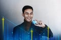 Globalization and Worldwide Business Marketing Concept. Happy Smiling Businessman holding a Transparent Blue World Globe in Hand. Royalty Free Stock Photo