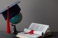 Globe, academic cap, diploma and open Royalty Free Stock Photo