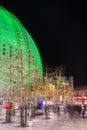 Globe arena building illuminated in green and trees decorated with led lights during Christmas season