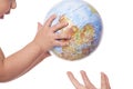 Globe in baby's hands.