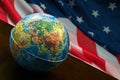 The globe on the background of the American flag Royalty Free Stock Photo