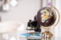 Globe and camera on table Royalty Free Stock Photo