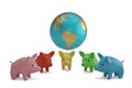 Globe and colorful piggys on white background 3D illustration. Royalty Free Stock Photo