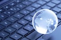 Globe On Computer Keyboard Royalty Free Stock Photo
