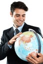 Globe, earth and man employee with planet sphere feeling happy about global travel. International, person and happiness Royalty Free Stock Photo