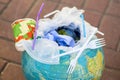 Globe filled with plastic trash. The concept of pollution by plastic debris. Earth contamination