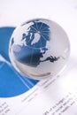 Globe with financial papers Royalty Free Stock Photo