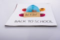Globe, flowers and back to school title Royalty Free Stock Photo