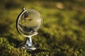 Globe Glass In Green Forest Environment Concept. Royalty Free Stock Photo