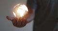 A globe in the hands of a young man, the concept of perceiving the change of people and the world