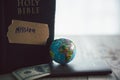 Globe with Holy Bible for mission, Mission christian idea. bible and book on wooden table, Christian background for great Royalty Free Stock Photo