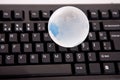 Globe on keyboard Royalty Free Stock Photo