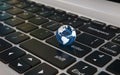 Globe on laptop keyboard, world news, globalisation concept, 3d rendering Royalty Free Stock Photo