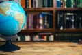 The globe in the library school, university, college on the table. Travel, learning and study concept. Copy space Royalty Free Stock Photo