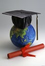 Globe with mortar board Royalty Free Stock Photo