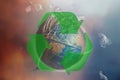 Globe of planet Earth in a garbage bag. Green recycling sign. The concept of conservation of the environment and its resources,