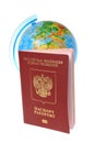 Globe and Russian international passport isolated on white
