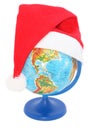 Globe with a Santa Claus hat Royalty Free Stock Photo
