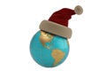 Globe with santa hat isolated on white background.3D illustration. Royalty Free Stock Photo