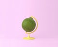 Globe sphere orb lemon, lime concepts on pastel pink background.