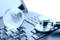 Globe and Stethoscope on a laptop keyboard Royalty Free Stock Photo