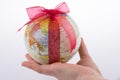 Globe tied with ribbon Royalty Free Stock Photo