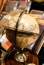 Globe on top of compass on display in gift shop Royalty Free Stock Photo
