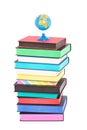 A globe on top of stack of colorful books Royalty Free Stock Photo