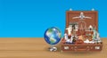 Globe travel landmark in suitcase with airplane