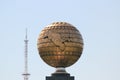 Globe with Uzbekistan and old TV tower in Tashkent