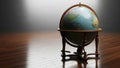 Globe on wooden table with spotlight Royalty Free Stock Photo