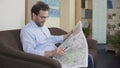 Globetrotter planning trip, adult man looking at map, vacation and traveling