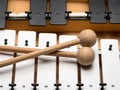 A Glockenspiel with black and white keys and wooden mallets