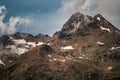 gloomy atmospheric rocks, dark mountains covered with clouds and puffs of fog. Mountain peak of snow-capped mountains, beautiful Royalty Free Stock Photo