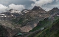 gloomy atmospheric rocks, dark mountains covered with clouds and puffs of fog. Mountain peak of snow-capped mountains, beautiful Royalty Free Stock Photo