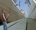 Gloomy concrete tunnel and teenager with smartphone