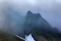 Clouds slide over from glacier and cliff to sea Royalty Free Stock Photo