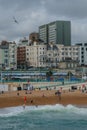 Beach-Goers On A Gloomy Brighton Beach