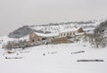 Gloomy haunted farm house barn winter mountain snow Royalty Free Stock Photo