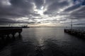 Gloomy heavy rain clouds rolling in from the horizon, calm before storm. Geelong beach, Australia Royalty Free Stock Photo