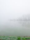 The gloomy landscape of the morning mist in the river valley.