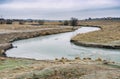 Autumnal landscape with small drying off river Royalty Free Stock Photo