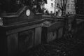 Gloomy monuments of the cemetery on sunny autumn afternoon. Royalty Free Stock Photo