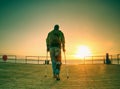 Gloomy nostalgic silhouette of sad lonely adult man with hooded jacket Royalty Free Stock Photo