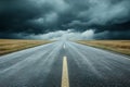 Gloomy storm clouds amassing above a deserted asphalt road Royalty Free Stock Photo