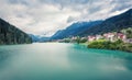 Gloomy summer view of Auronzo di Cadore and its lake in province of Belluno, Veneto, Italy. Dramatic morning scene of Dolomite Royalty Free Stock Photo