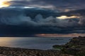 Gloomy thunderclouds over the seashore, long exposure photo