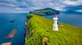 Gloomy view from flying drone of Mykines island with old lighthouse. Attractive morning scene of Faroe Islands, Denmark, Europe. D